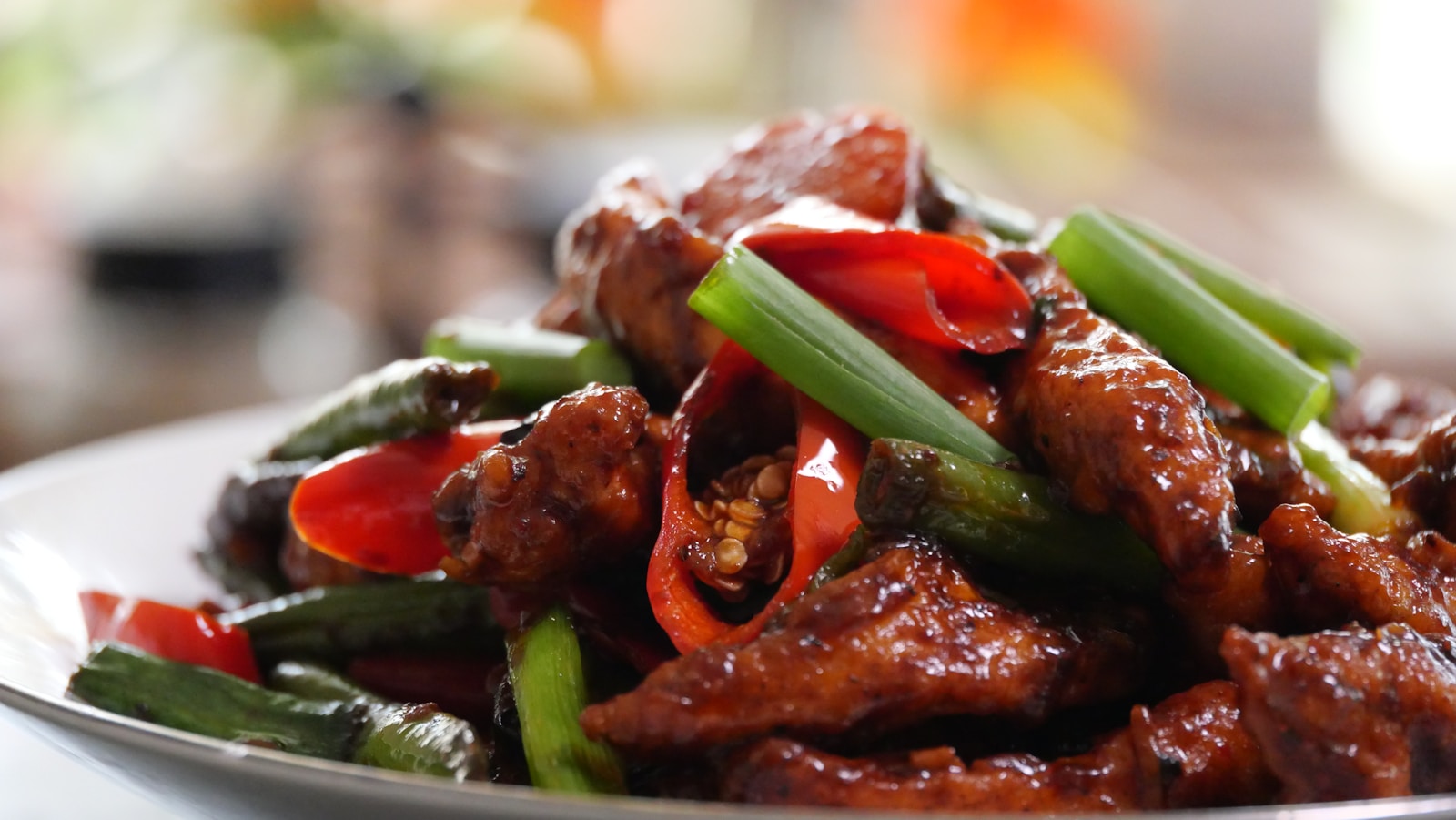 a close up of a plate of food with meat and vegetables